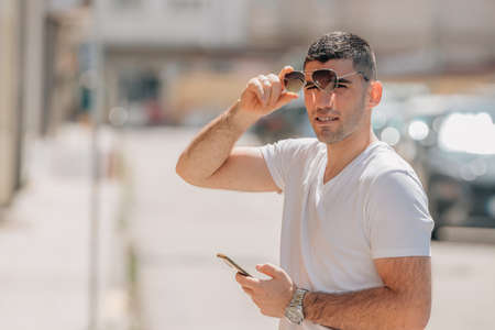 man with mobile phone on the street