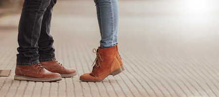 couple feet on the street in autumnの写真素材