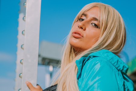 fashionable modern girl in the amusement parkの写真素材