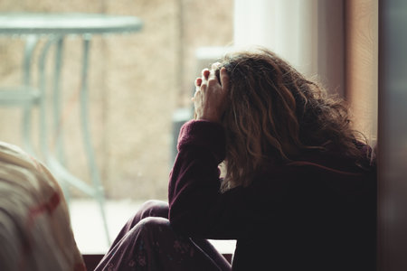 woman at home with depression, loneliness or sadness