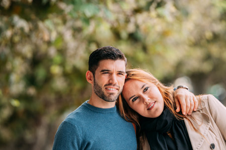 couple embracing in autumn outdoors