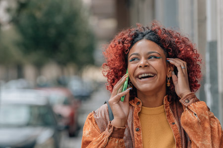 modern woman talking on mobile phone in the streetの写真素材