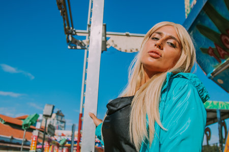 fashionable modern girl in the amusement parkの写真素材