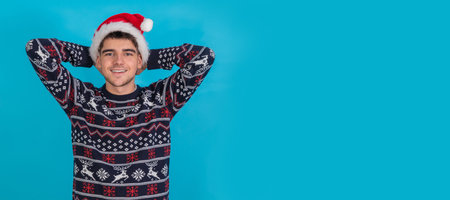 young man in christmas outfit isolated on color background