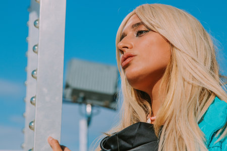 blonde girl portrait outdoors in profileの写真素材