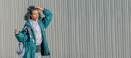 urban trendy casual latina girl outdoorsの写真素材