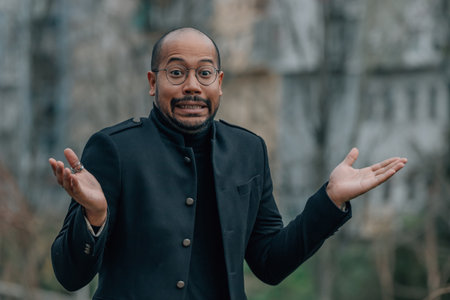latino man in the street with expression of surprise or amazement