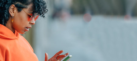 profile girl on the street with mobile phoneの写真素材