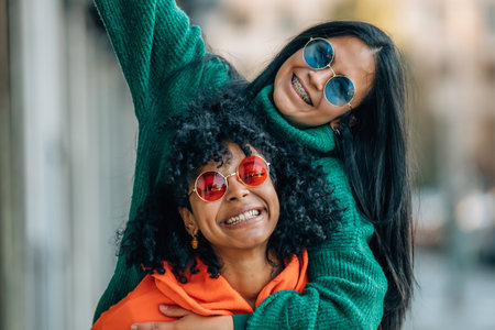 girl couple on the street smiling funnyの写真素材