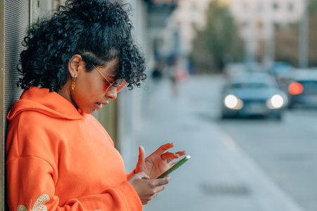 profile girl on the street with mobile phoneの写真素材