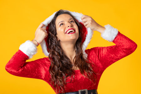 smiling santa claus girl isolated on color backgroundの写真素材