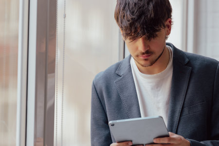 young man or student with digital tablet or device