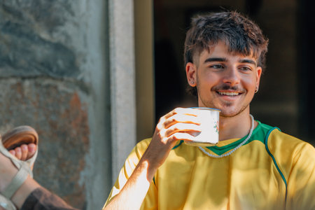 smiling young people talking together outdoors