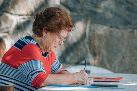 senior woman with hobbies or crosswords