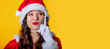 isolated santa claus woman with thoughtful expressionの写真素材