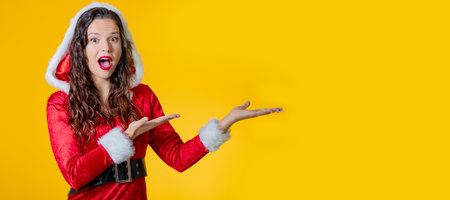 isolated santa claus woman pointing with copy-spaceの写真素材