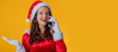 isolated santa claus girl talking on mobile phoneの写真素材