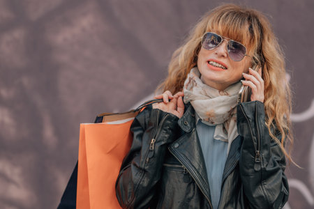 shopping woman with mobile phoneの写真素材