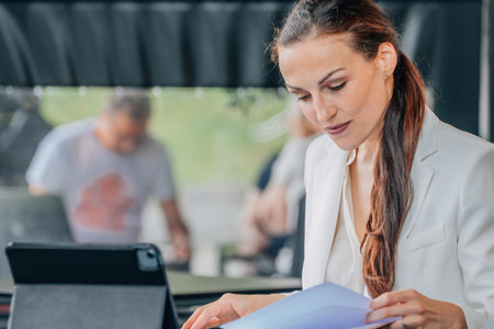 business woman with laptop in cafe workingの写真素材