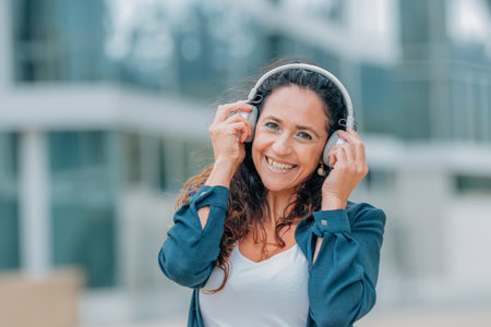 urban woman on the street with headphones