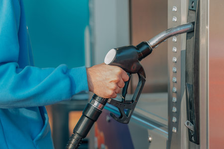 young man at the service station or gas stationの写真素材