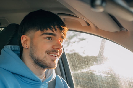 novice or young driver driving in the car
