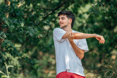 young man outdoors doing exercise, sport