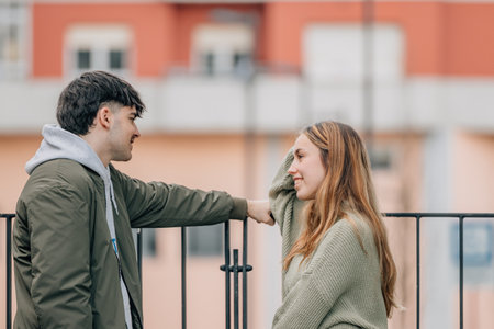 couple on the street talking intimatelyの写真素材