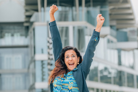 business woman on the street euphoric with joyの写真素材