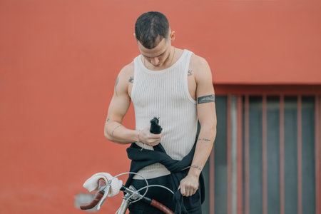 young man with bicycle on the street