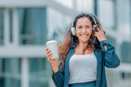 urban woman on the street with headphonesの写真素材