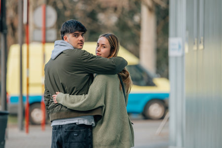 urban young couple on the street walking holdingの写真素材