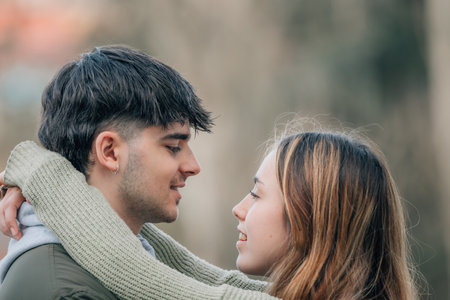 urban young romantic couple on the street hugging