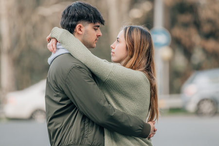 urban young romantic couple on the street huggingの写真素材