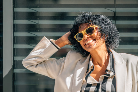 portrait of smiling woman with sunglassesの写真素材