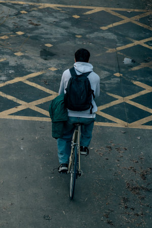 top view of a young man riding a bicycleの写真素材