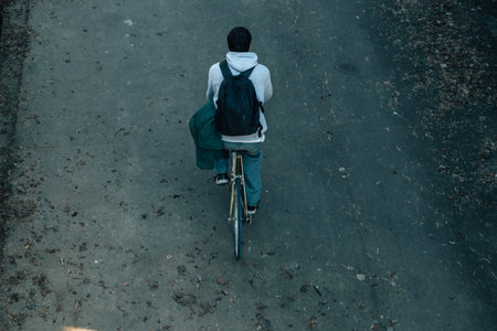 top view of a young man riding a bicycleの写真素材