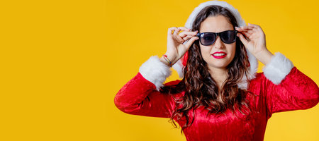 woman santa claus with sunglasses