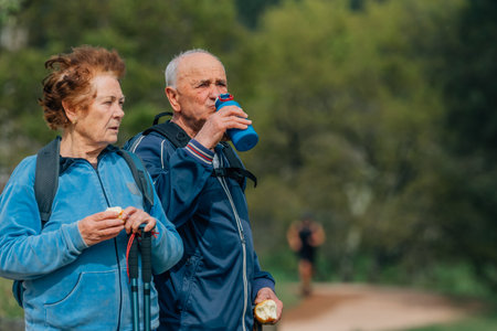 senior couple hiking outdoors in natureの写真素材