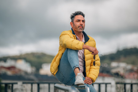 Person in yellow jacket and sunglasses on the streetの写真素材