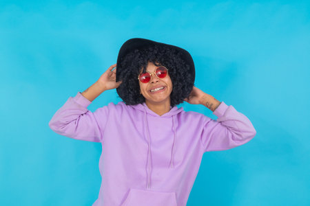 afro american girl with sunglasses isolated on background