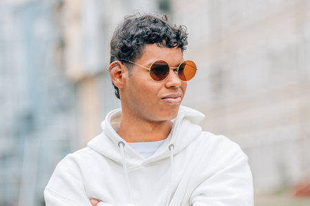 portrait young man with sunglasses on the street