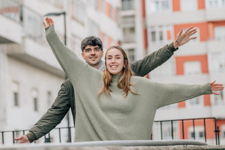 happy couple on the street with open arms