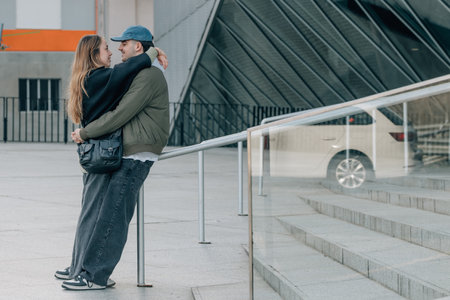 couple of boy and girl on the street outdoors huggingの写真素材