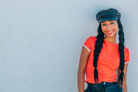 portrait of urban hipster girl smiling on the street in summerの写真素材