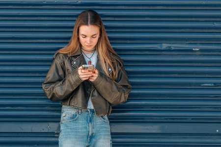 girl on the street with mobile phoneの写真素材
