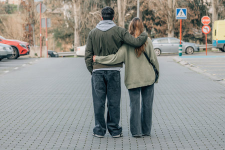 urban young romantic couple on the street hugging