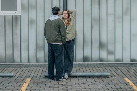 urban young romantic couple on the street flirting or talkingの写真素材
