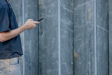 young man's hands with mobile phone and copyspace