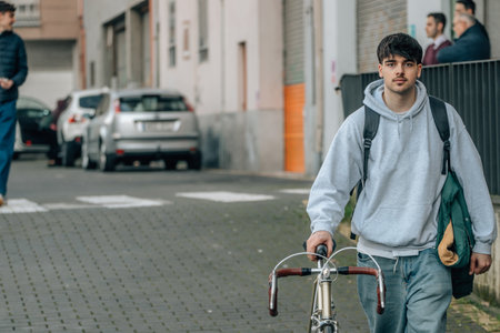 student with vintage bicycle and young american outfitの写真素材